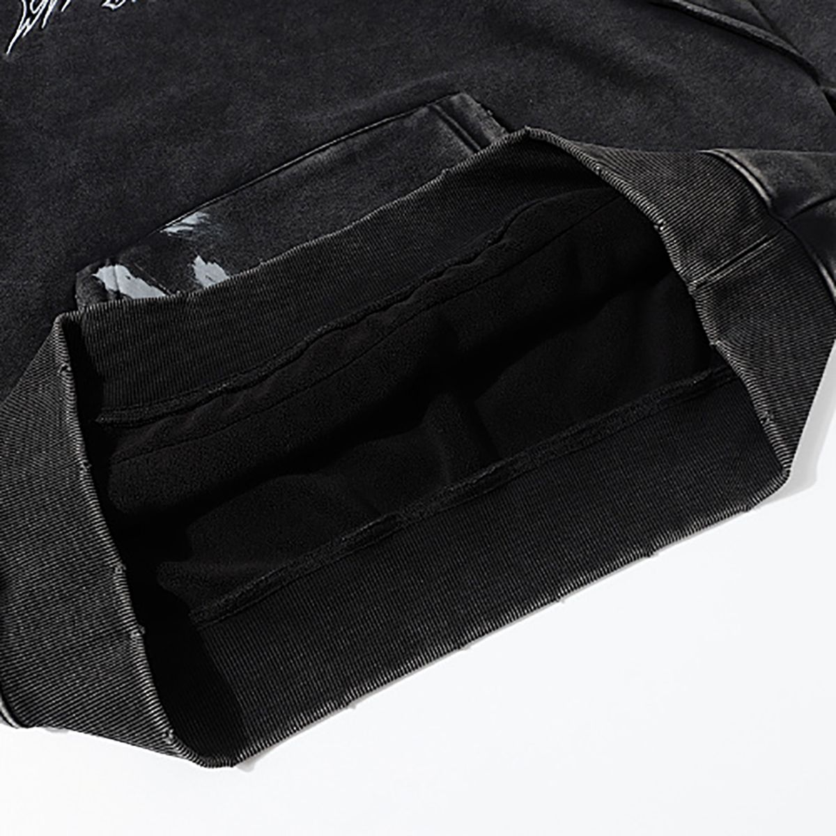 Close-up of men's black heavyweight hoodie pocket interior, vintage streetwear