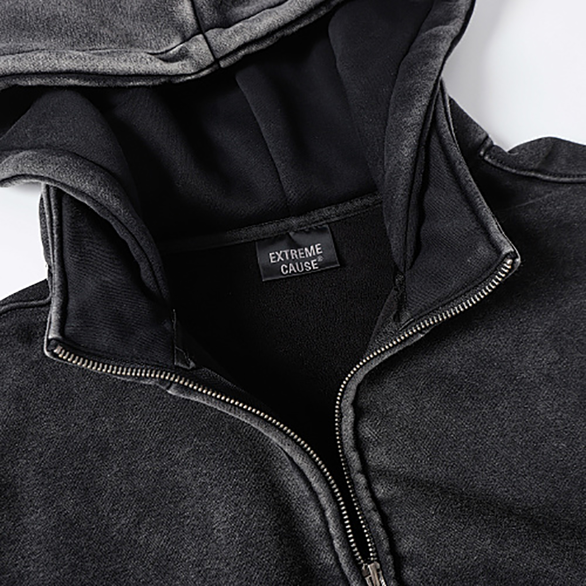 Close-up of men's black heavyweight double-zip hooded fleece zip-up jacket, showing inner lining detail