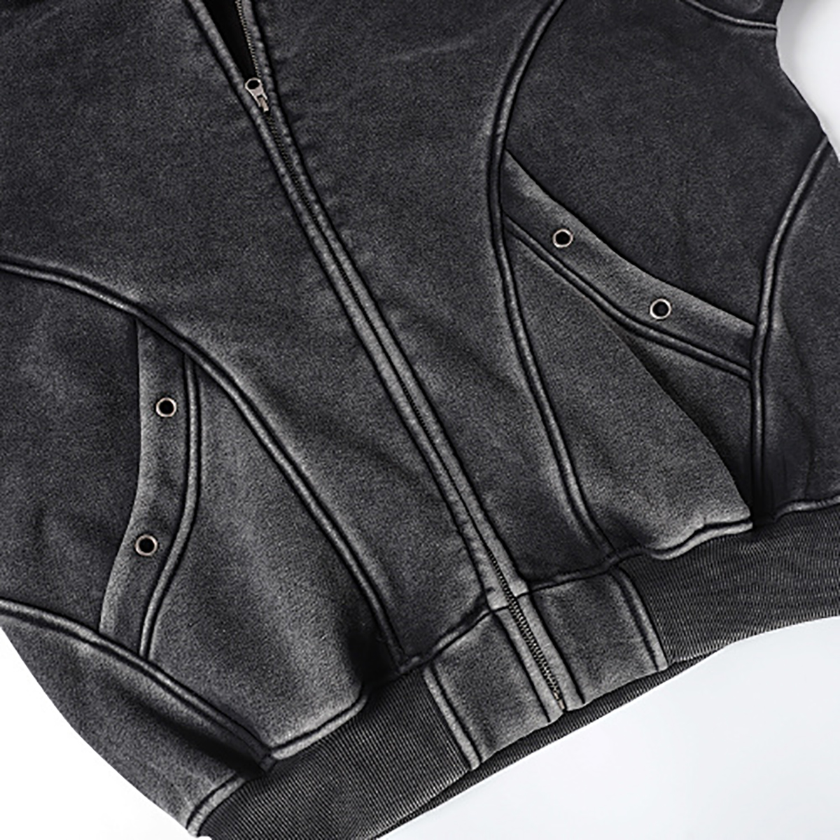 Close-up of men's black heavyweight double-zip hooded fleece zip-up jacket, showing pocket detail