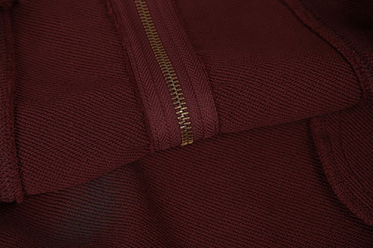 Close-up of burgundy hooded zip-up sweatshirt showing front zipper and fabric texture detail