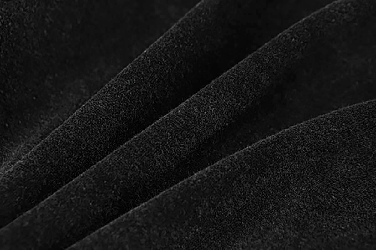 Close-up of men's black American heavyweight vintage deconstructed patchwork hoodie, showing inner fleece lining detail