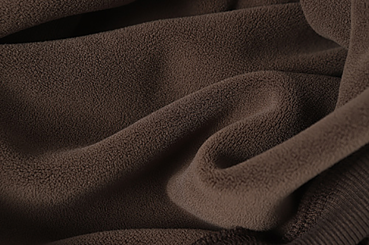 Close-up of men's coffee brown American retro patchwork hooded sweatshirt, showing soft fleece fabric texture
