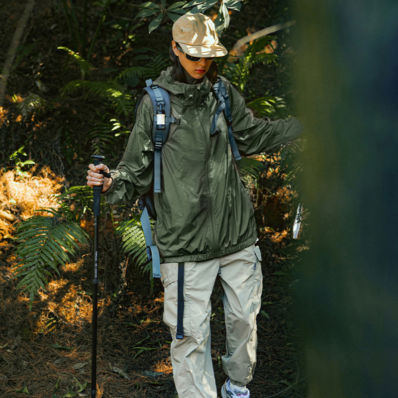 Green hiking jacket worn outdoors