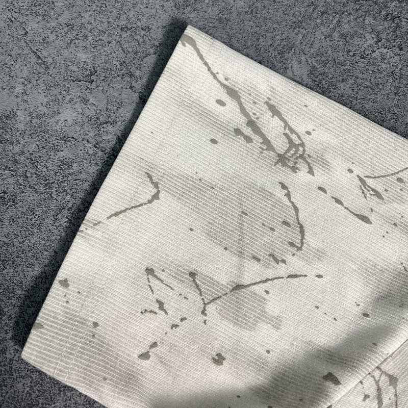 Beige Spray Washed Fabric Texture Close-Up